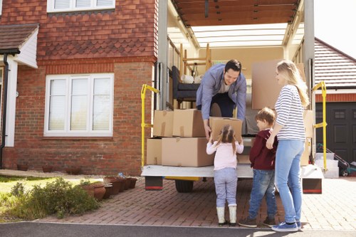 Professional movers handling office furniture during relocation